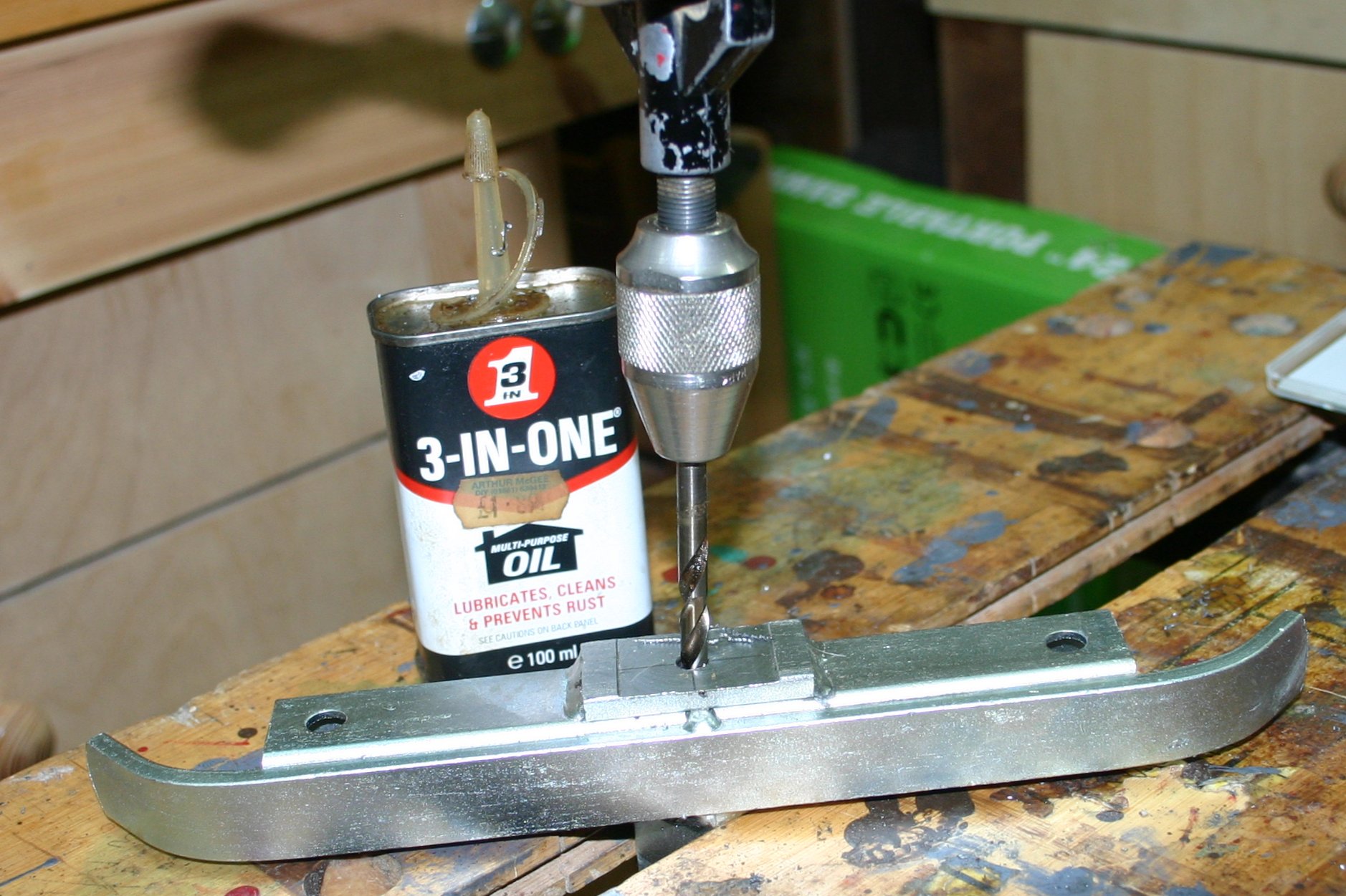 Drilling a new attachment point in the mill rear clamp.