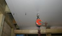 Plasterboard ceiling installation.