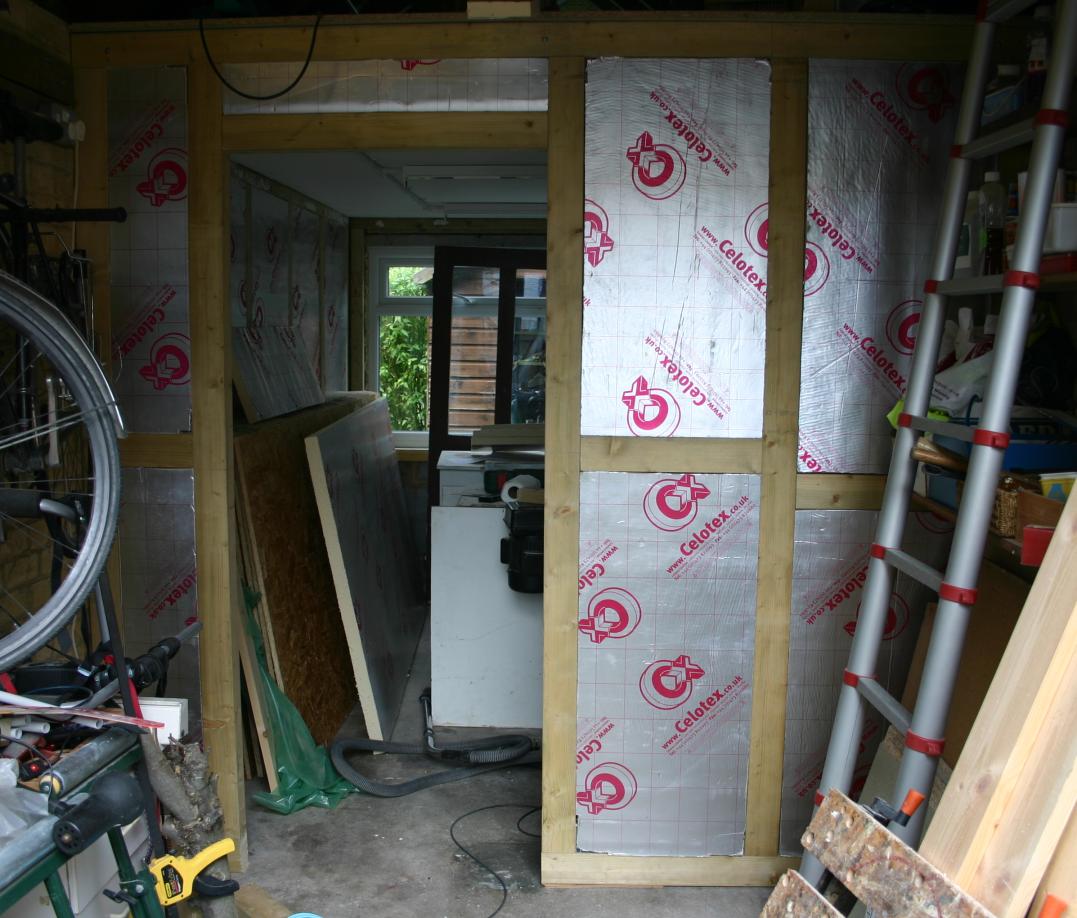 Insulation board installed in studwork.