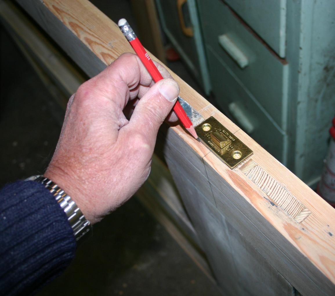 Drawing round the tubular latch for chiselling rebate.