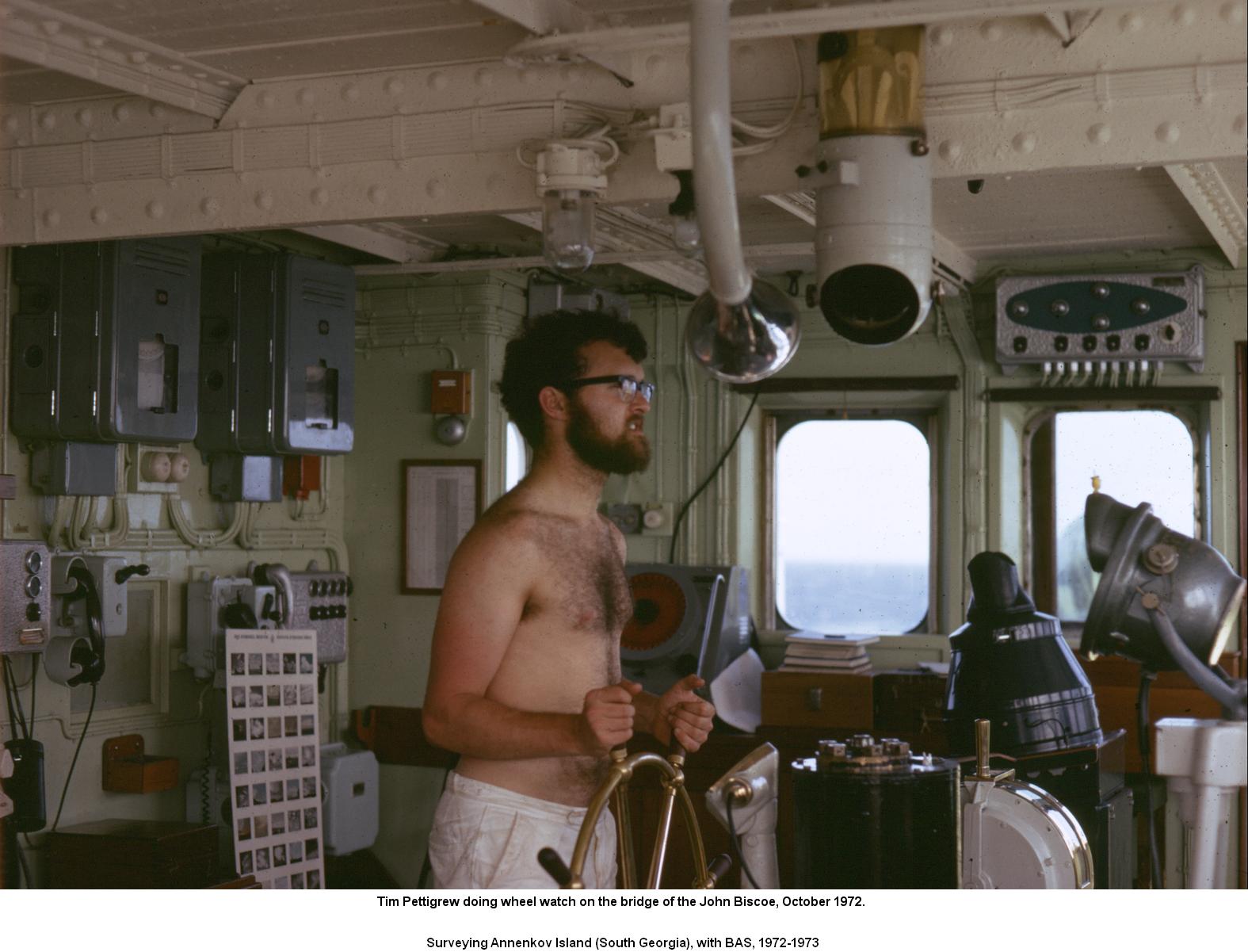 On wheel watch on the bridge of the John Biscoe, October 1972.