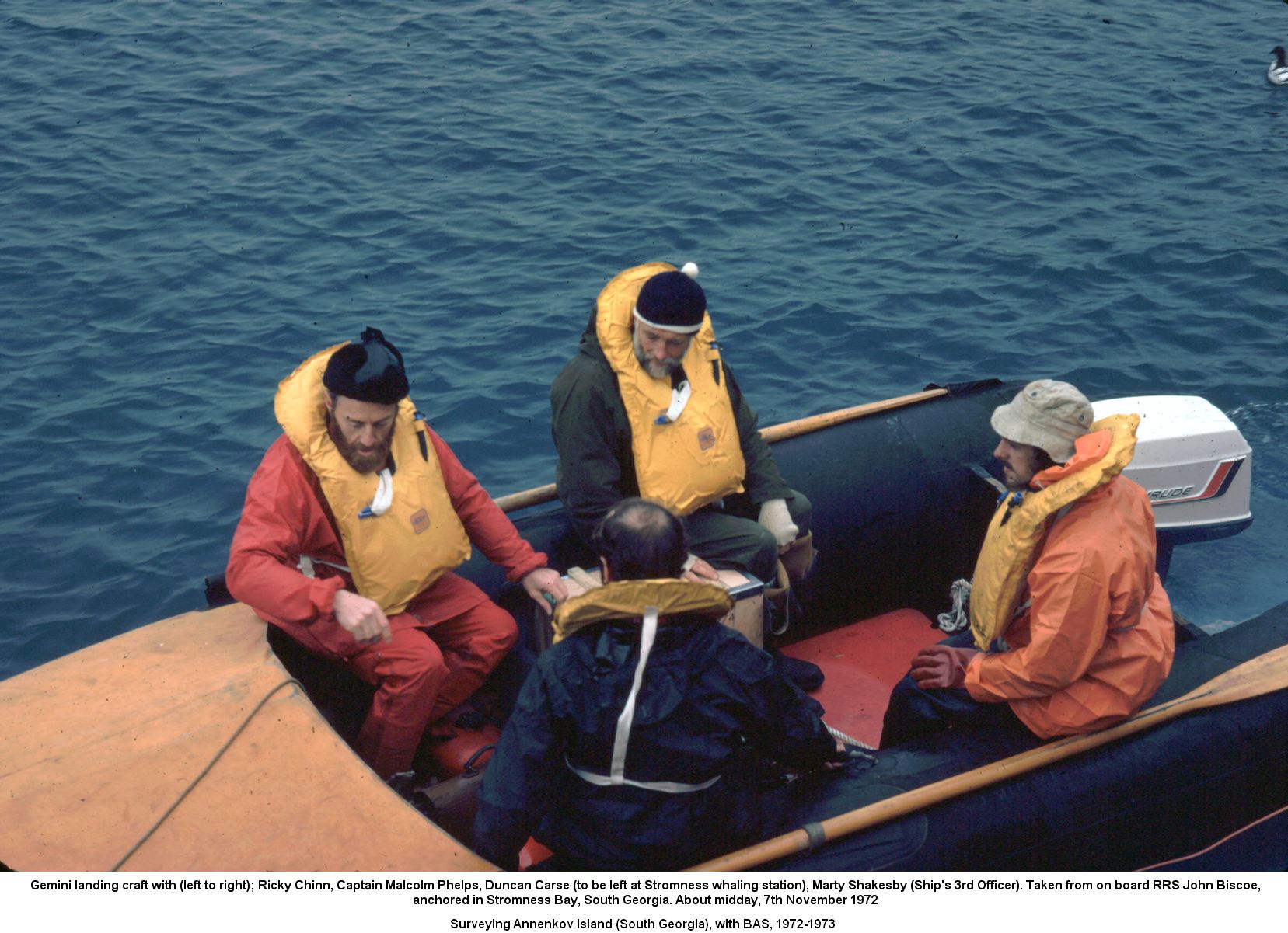 Gemini landing craft with (left to right); Ricky Chinn, Captain Malcolm Phelps,
Duncan Carse (to be left at Stromness whaling station), Marty (Ship's Officer).  Taken from on board RRS John Biscoe, anchored in Stromness Bay, South Georgia.  About midday, 7th November 1972.