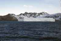 View from the deck of the RRS John Biscoe of a large tabular iceberg grounded off Cumberland Bay on the north-eastern coast of South Georgia. Afternoon of the 7th November 1972.