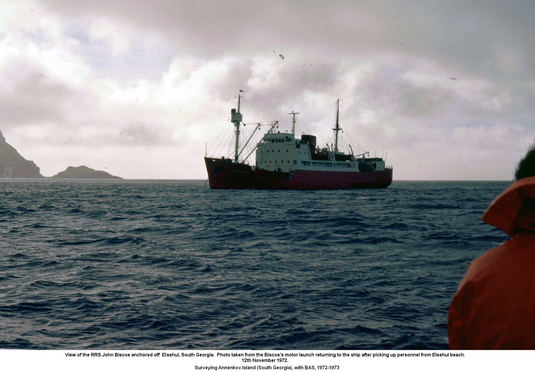 View of the RRS John Biscoe anchored off Elsehul, South Georgia.  Photo taken from the Biscoe's motor launch returning to the ship after picking up personnel from Elsehul beach. 
12th November 1972.