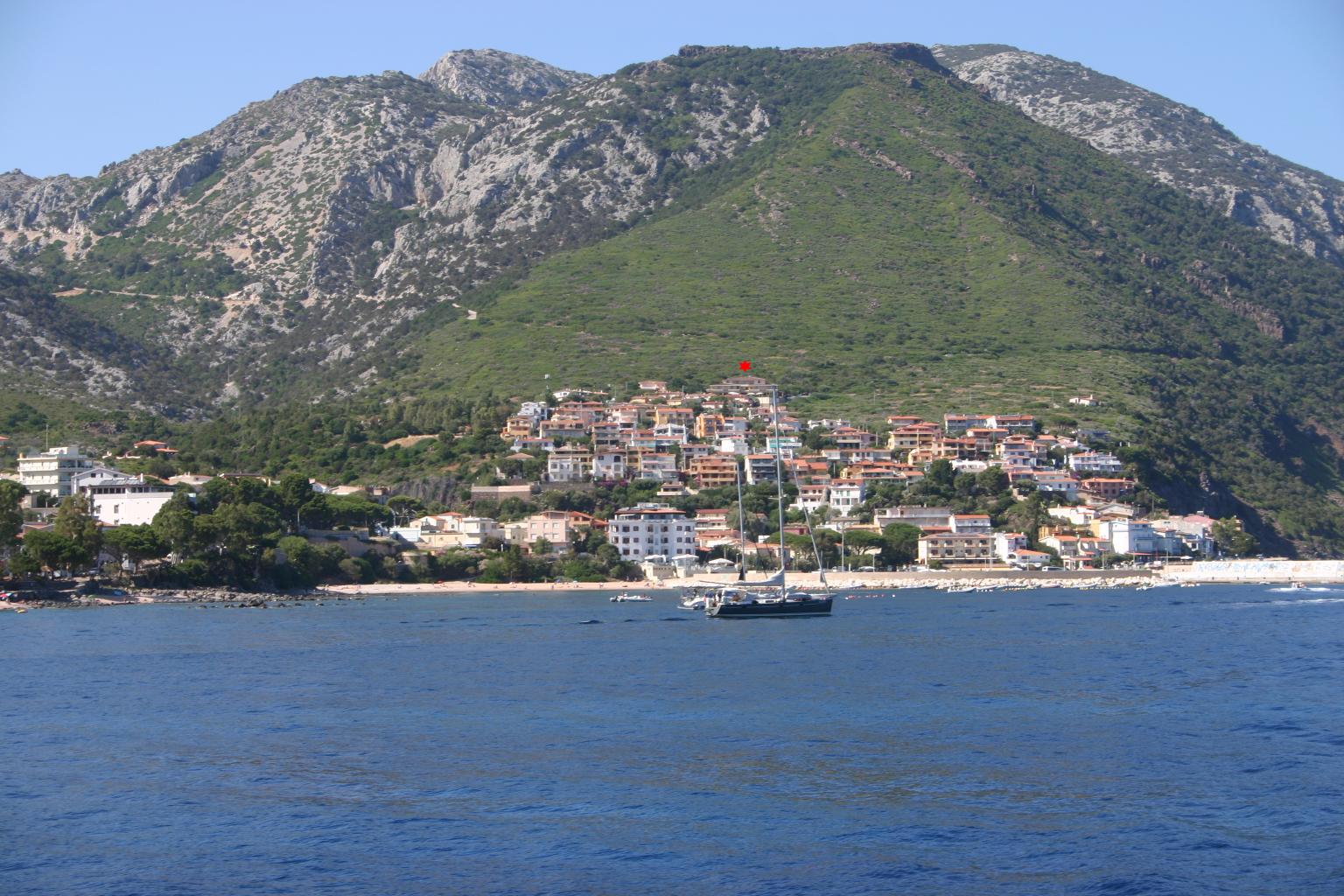 [Wednesday 8th June, view from a boat of Cala Gonone, Sardinia, our hotel is marked by a red star.